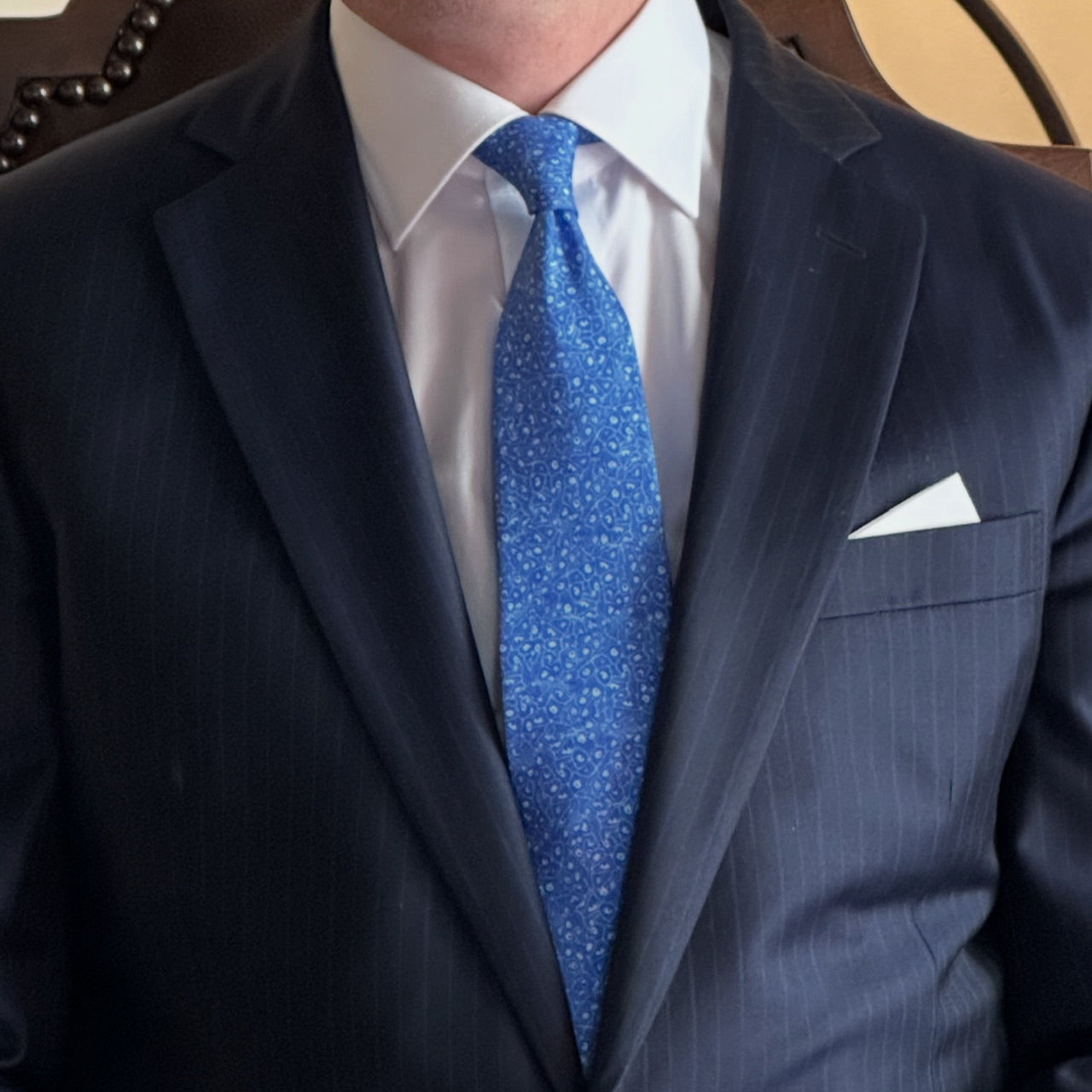 Man wearing the Complexion Blue silk tie, inspired by the epidermis