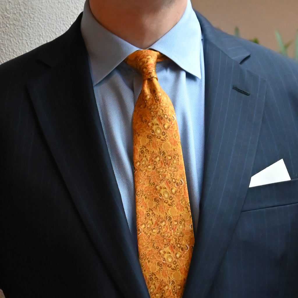 Man wearing the Beauty and Brains silk tie, inspired by the neurons