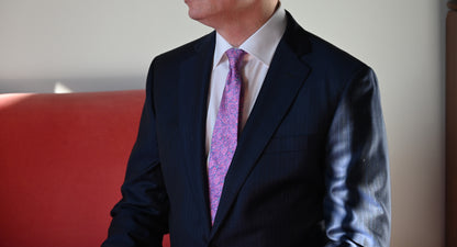 Man wearing the Thyroidea silk tie, inspired by the thyroid gland