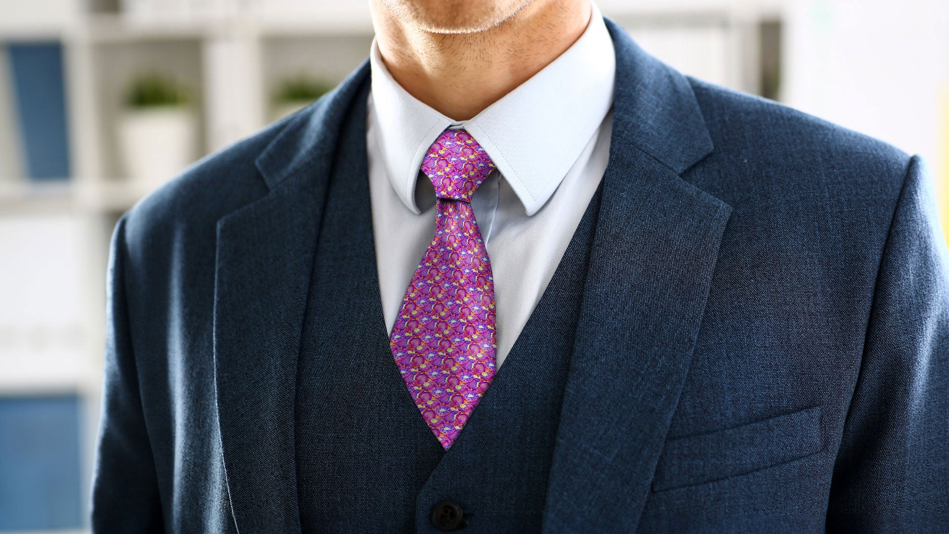 Man wearing the La Reproduction silk tie, inspired by the anatomy of the male reproductive tract